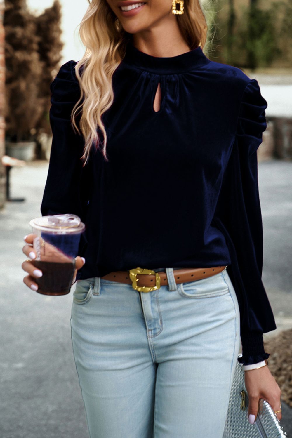 Velvet keyhole puff-sleeve blouse in dark blue with gathered shoulders.