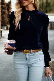Velvet keyhole puff-sleeve blouse in dark blue with gathered shoulders.