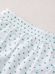 White baby set with green embroidered dots and elastic waistband