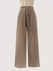 Khaki wide-leg drawstring pants with a ribbed texture and elastic waistband.