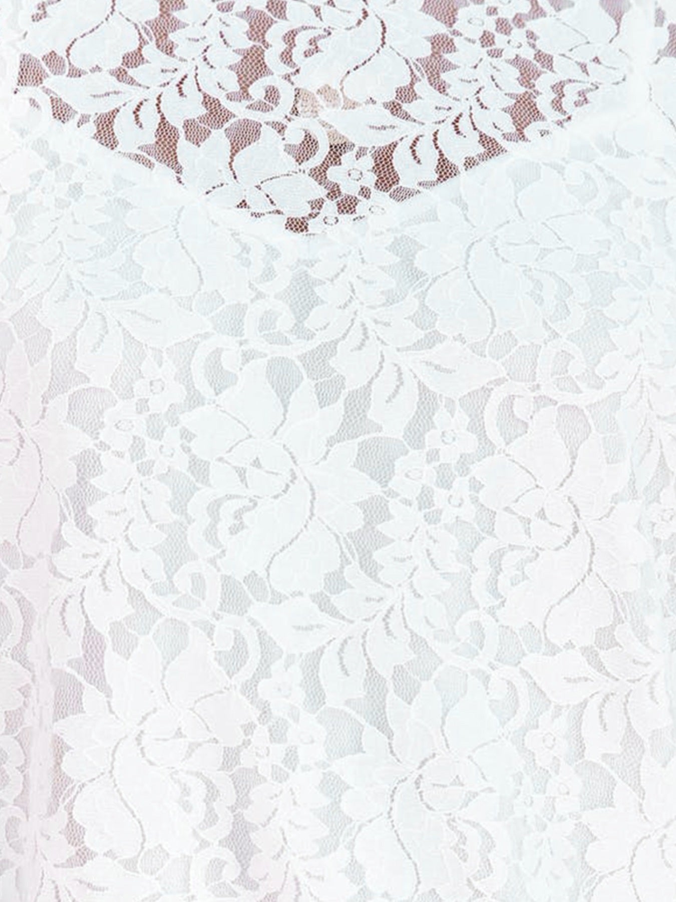 White lace short sleeve blouse with floral pattern and sheer overlay detail.