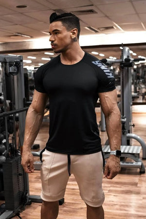 Black performance tee with grey shoulder print and crew neck.