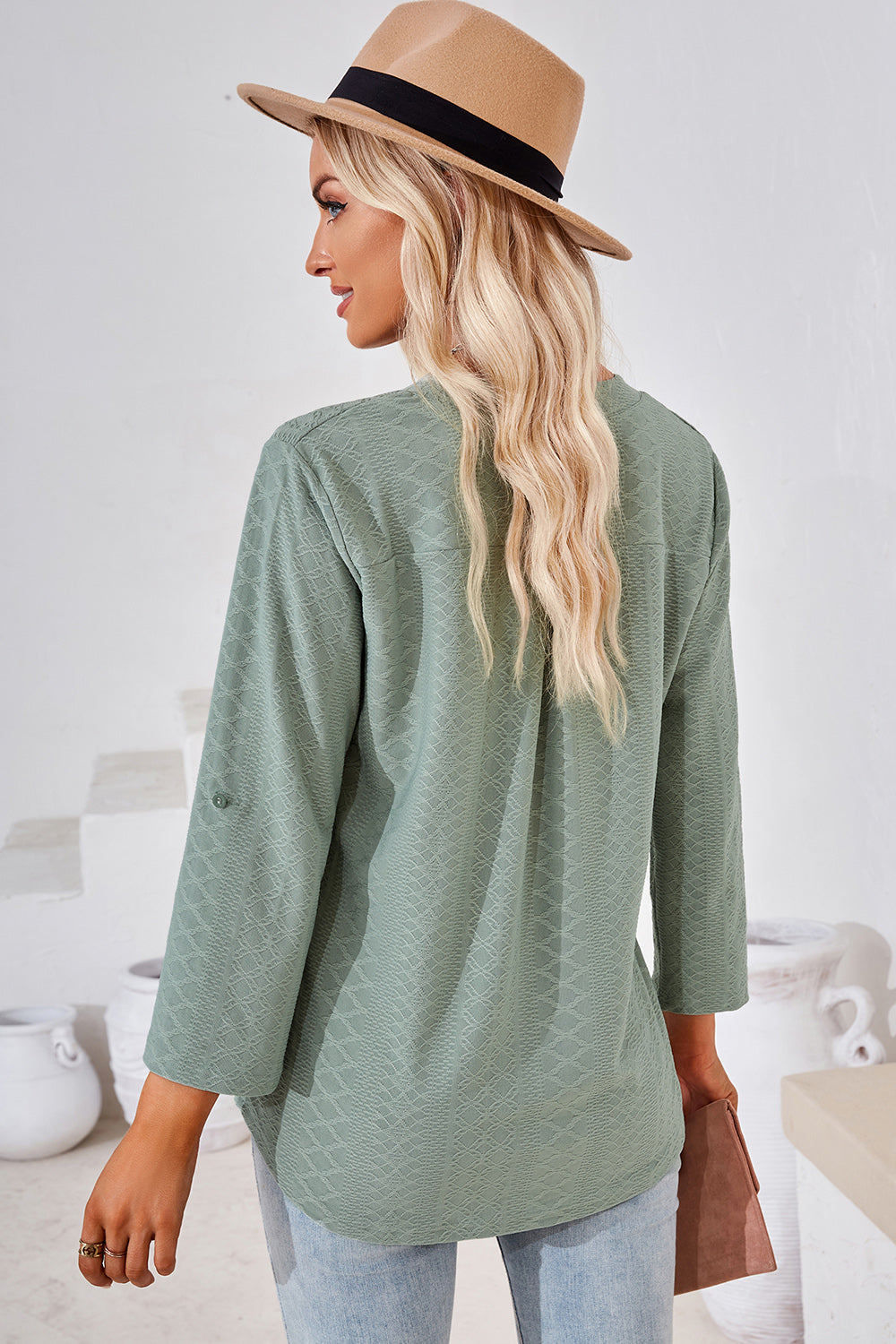 Light Green textured henley shirt with roll-tab sleeves and a relaxed fit.