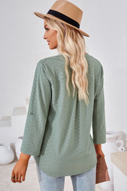 Light Green textured henley shirt with roll-tab sleeves and a relaxed fit.