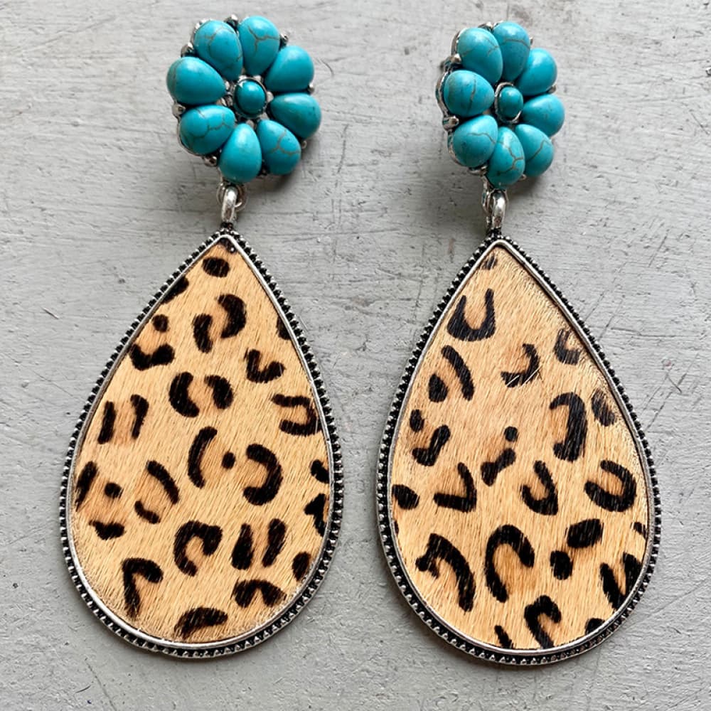 Turquoise petal & hide teardrop earrings with leopard print detail.