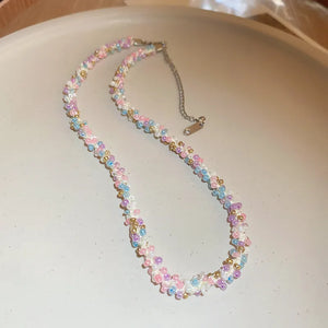 Pastel petal chain necklace with pink, purple, and blue beads and gold accents