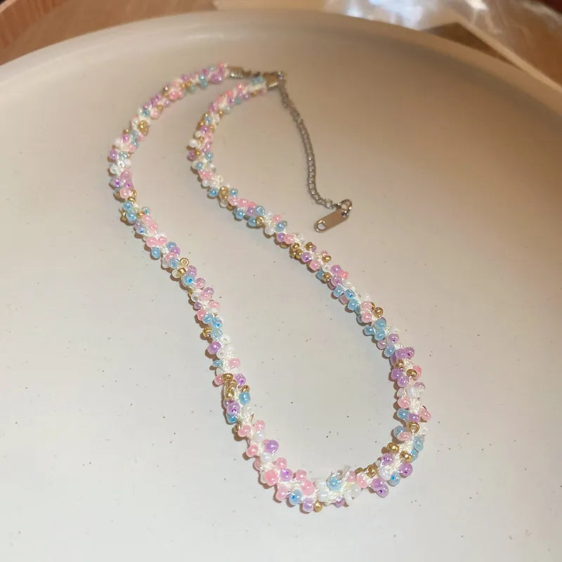 Pastel petal chain necklace with pink, purple, and blue beads and gold accents