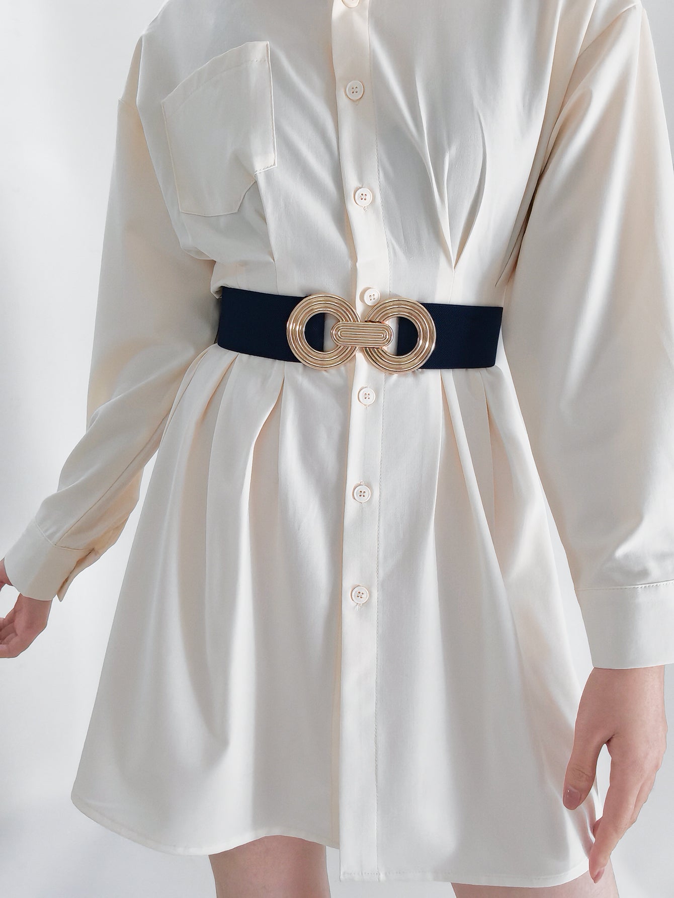 Interlocking Circle Stretch Belt in black with gold interlocking buckle detail.