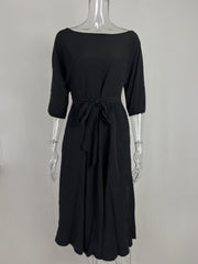 Black belted midi dress with 3/4 sleeves and a tie waist.