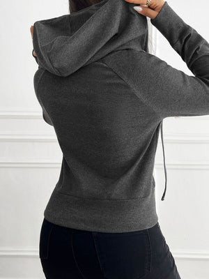Dark gray ribbed crop hoodie with drawstring hood and silver zip detail.
