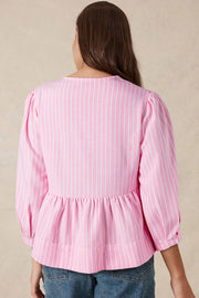 Blush pink striped peplum blouse with puff sleeves and gathered waist