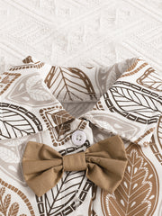 Baby bow top with leaf print and button detail in beige and camel.