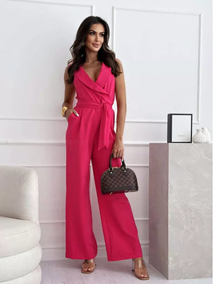 Hot Pink wrap-front wide-leg romper with belted waist and V-neck.
