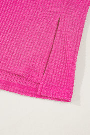 Hot pink waffle knit v-neck top with slit hem detail