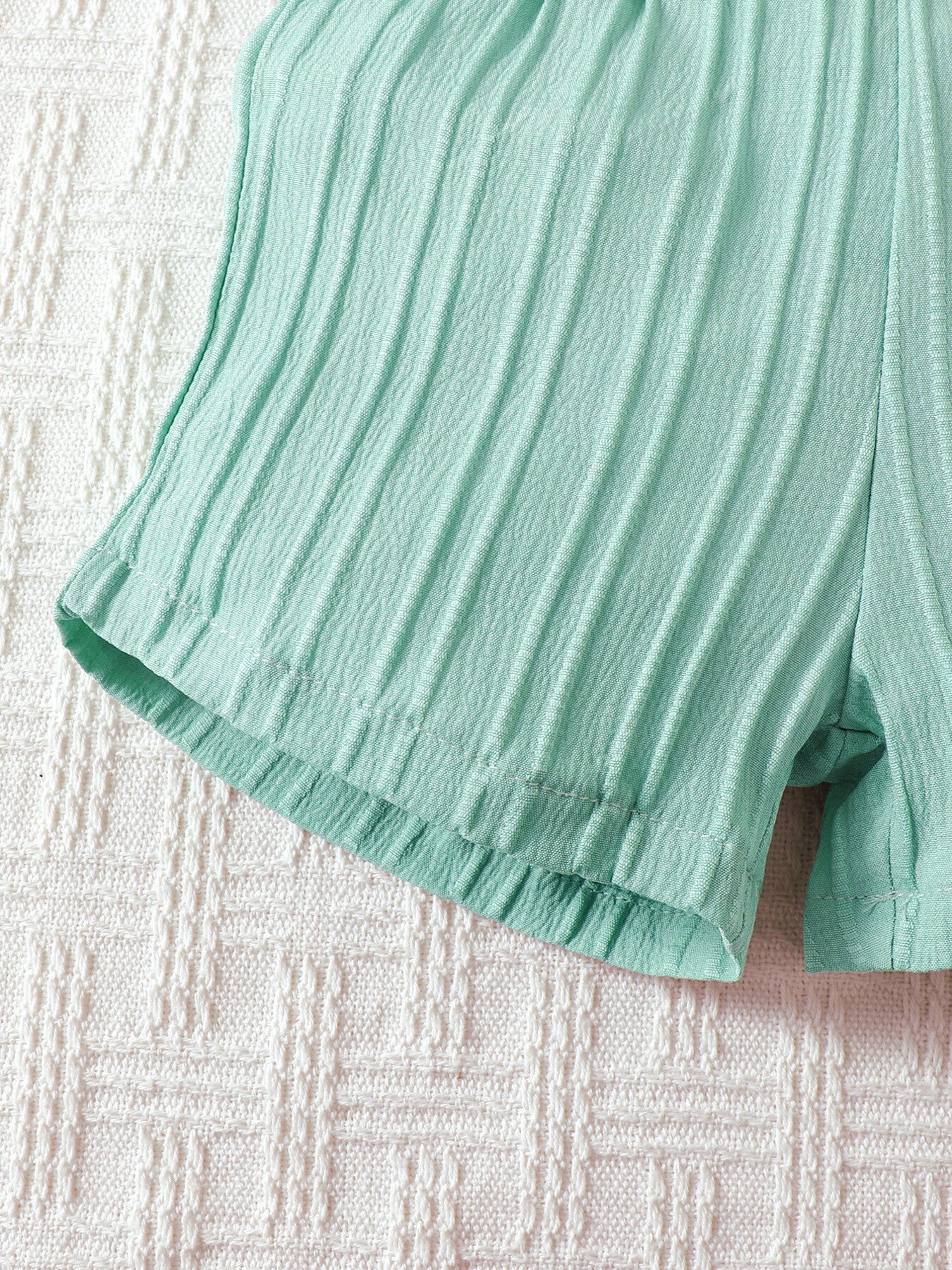 Baby mint green textured shorts with elastic waistband and hem