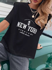Black graphic t-shirt with New York downtown athletic director print and round neck.