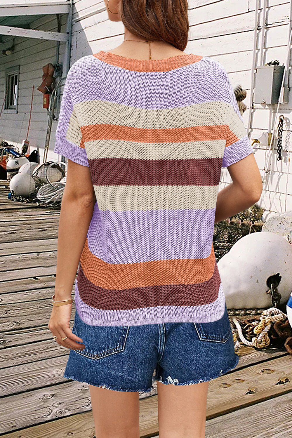 Coastal Stripe Knit Tee with short sleeves and a crew neck, featuring horizontal stripes in lavender, tan, rust, and maroon.