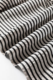 Chic black and white striped cotton tiered midi dress detail