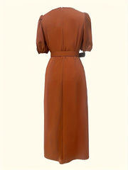 Belted midi dress in rust with puff sleeves and a-line cut.