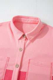Pink waffle knit shacket with button front, chest pockets and textured panels.