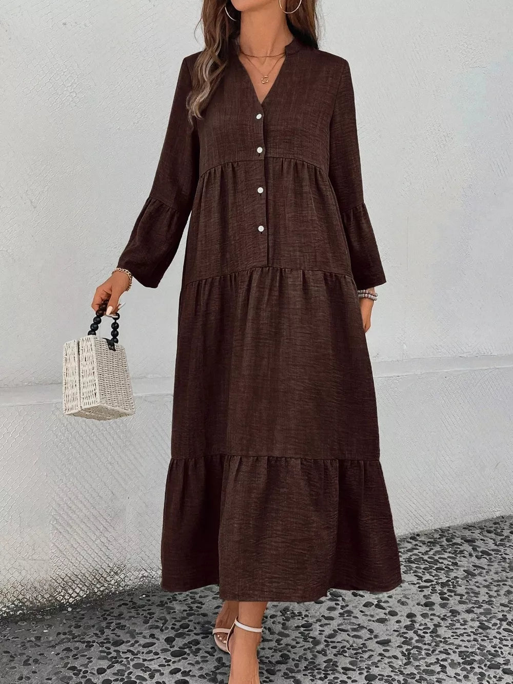 Brown tiered ruffle hem v-neck dress with button front and bell sleeves.