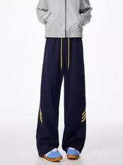 Dark navy sweatpants with yellow stripe detail and yellow drawstring.
