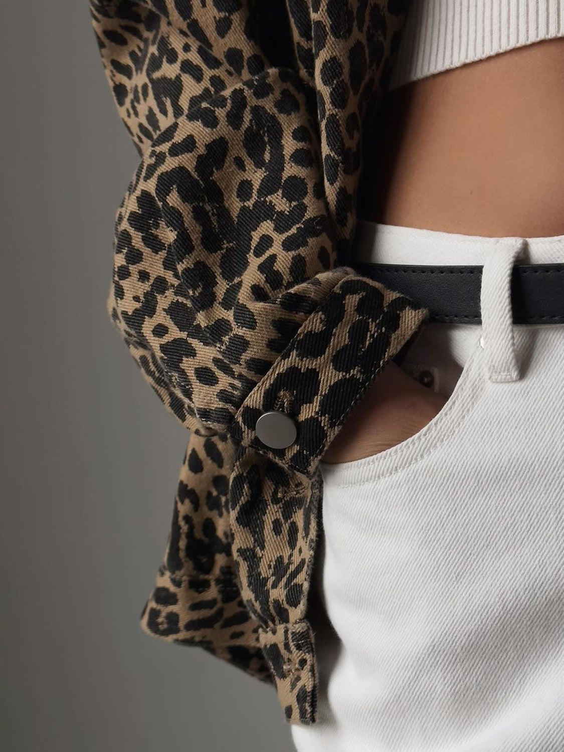 Oversized leopard wash denim jacket with button detail and white jeans.
