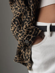 Oversized leopard wash denim jacket with button detail and white jeans.