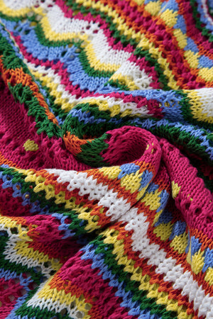Multicolor crochet knit sweater with a wave pattern in pink, green, blue, yellow, white, and orange.
