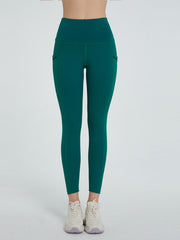 Dark Green Pocketed Sculpt Leggings with contrast stitching and side pockets.