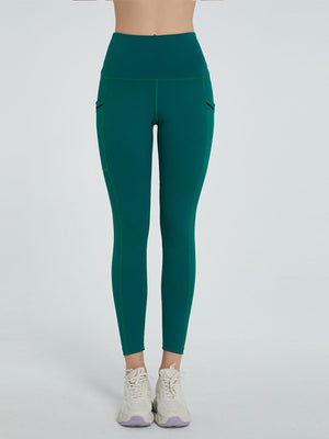 Dark Green Pocketed Sculpt Leggings with contrast stitching and side pockets.