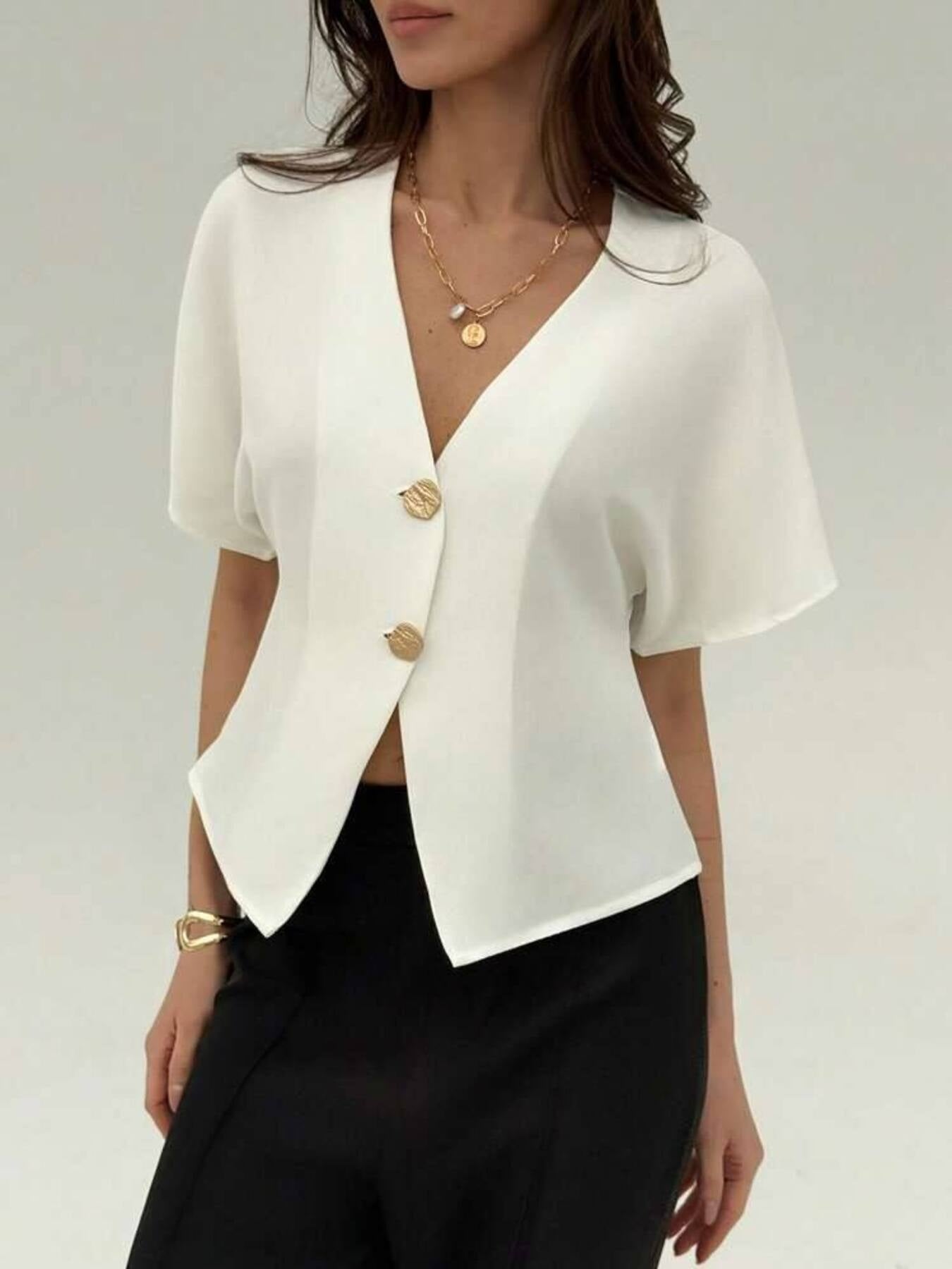 White button-down shirt with deep V-neck, short sleeves, and gold buttons.