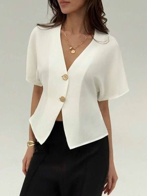 White button-down shirt with deep V-neck, short sleeves, and gold buttons.