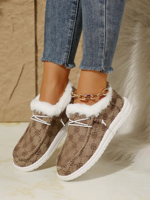 Southwestern print faux fur lined loafers in taupe with white laces and white soles.
