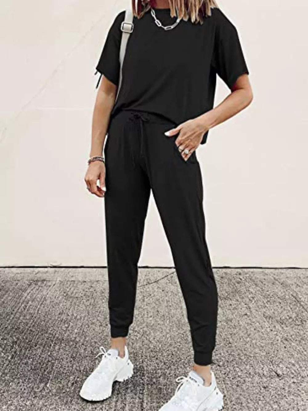 Black cotton round neck top and jogger pants set with drawstring waist.