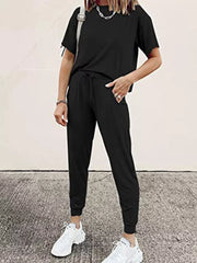 Black cotton round neck top and jogger pants set with drawstring waist.