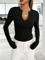 Black long sleeve contour zip top with plunging neckline and thumbholes.