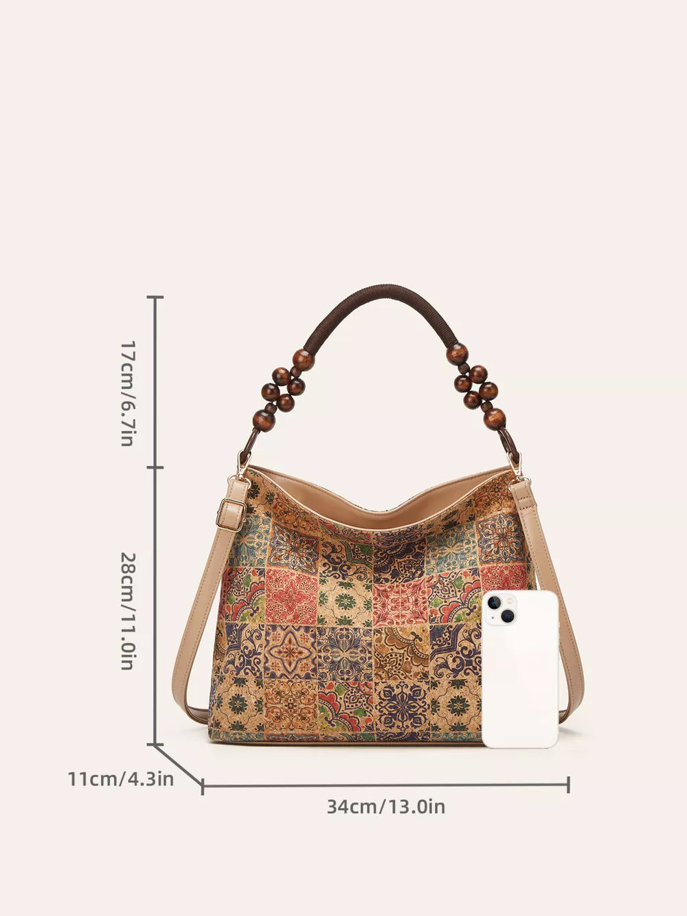 Vibrant bohemian hobo tote bag with colorful geometric tile pattern and beaded strap.