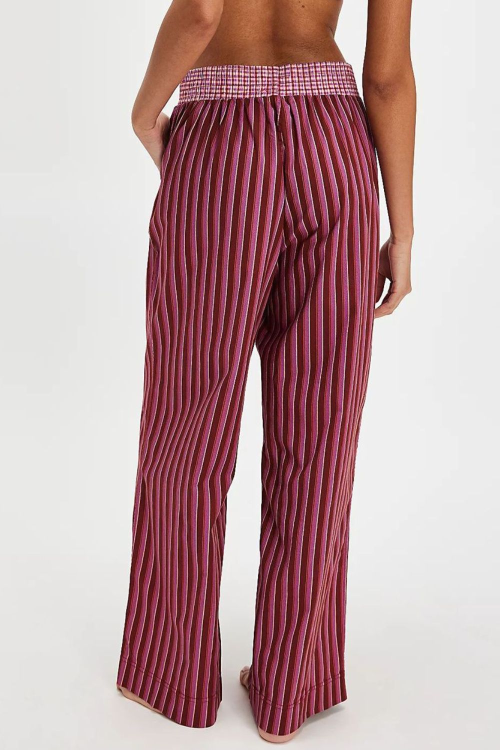 Crimson stripe palazzo trousers in cotton with a pink checkered waistband.
