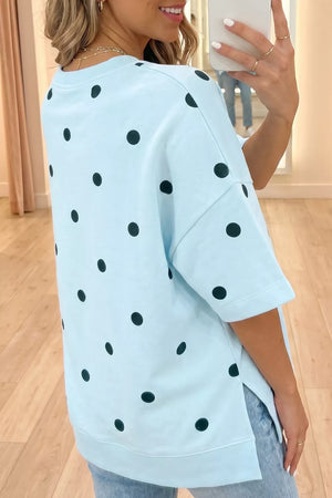 Light blue oversized t-shirt with black polka dots and short sleeves.