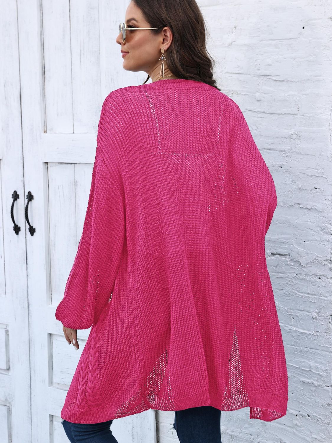 Cable knit cocoon cardigan in Deep Rose acrylic with open knit details and braided hem.