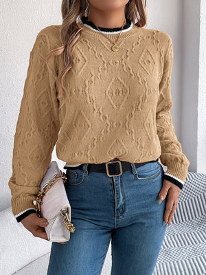 Tan textured diamond knit sweater with contrast trim neckline and cuffs.