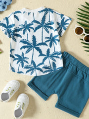 Baby set with white crew neck tee featuring blue palm trees and blue shorts.