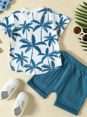 Baby set with white crew neck tee featuring blue palm trees and blue shorts.