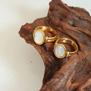 Gold mother-of-pearl oval signet ring with textured band detail
