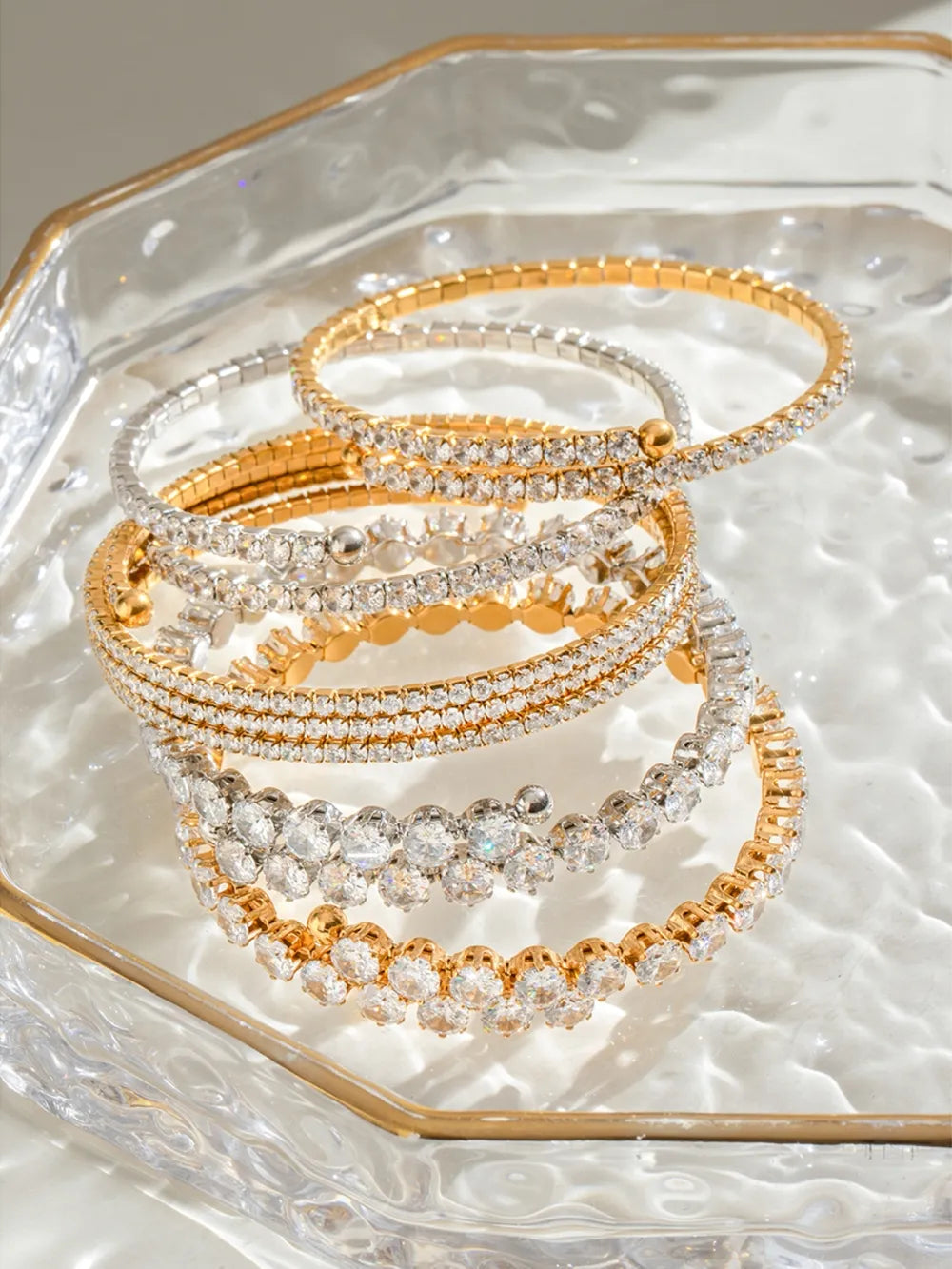 Gold and silver double row pavé bangles with clear crystals