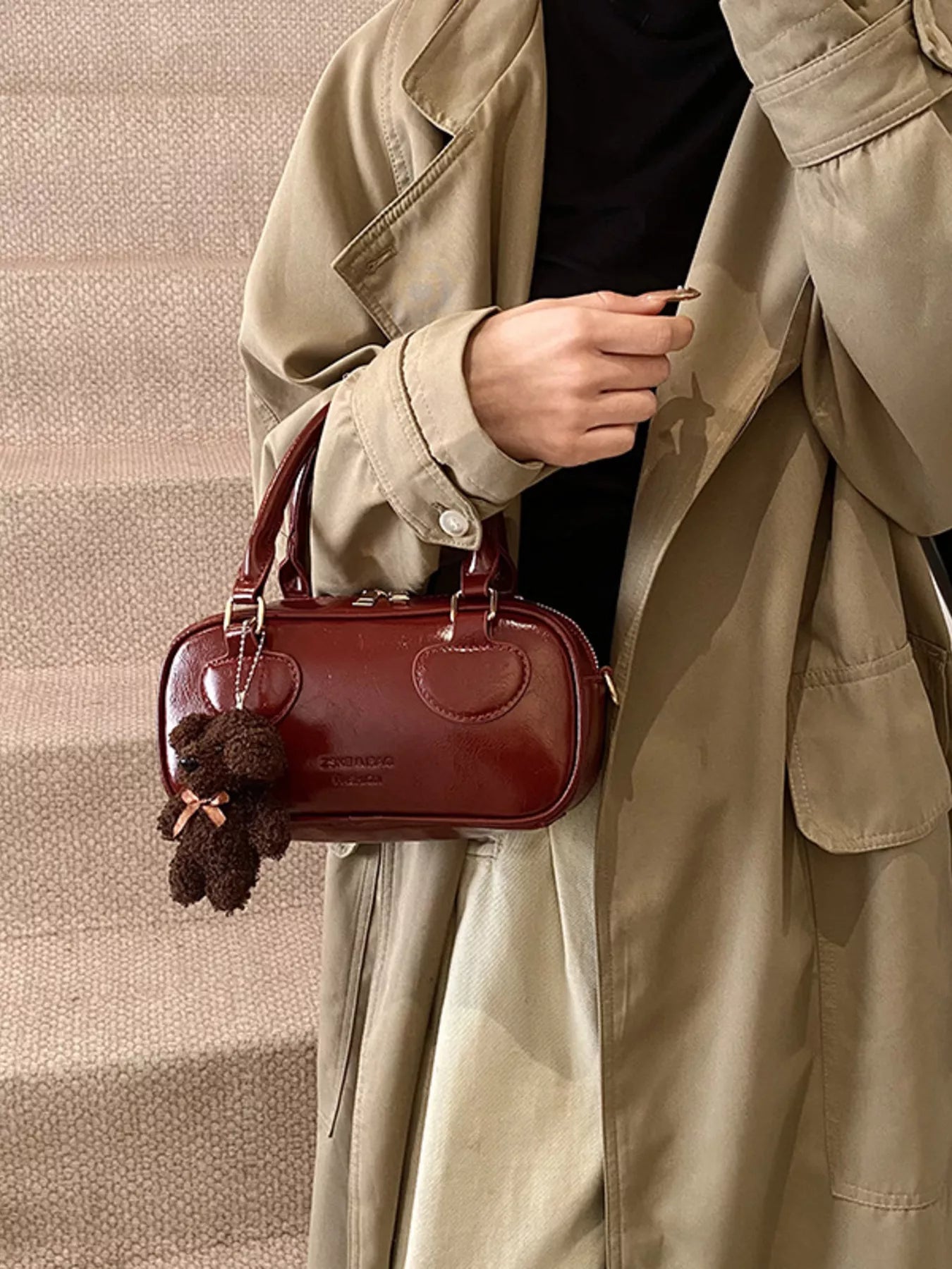 Chic mini crossbody bag in deep red PU leather with a teddy bear charm.