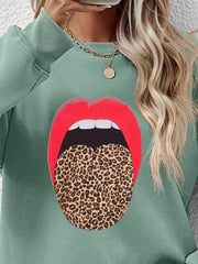 Sage sweatshirt with red lips and leopard tongue graphic.