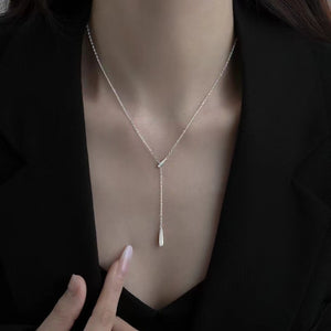 Elegant Y-shaped pendant necklace in sterling silver with a delicate drop detail.