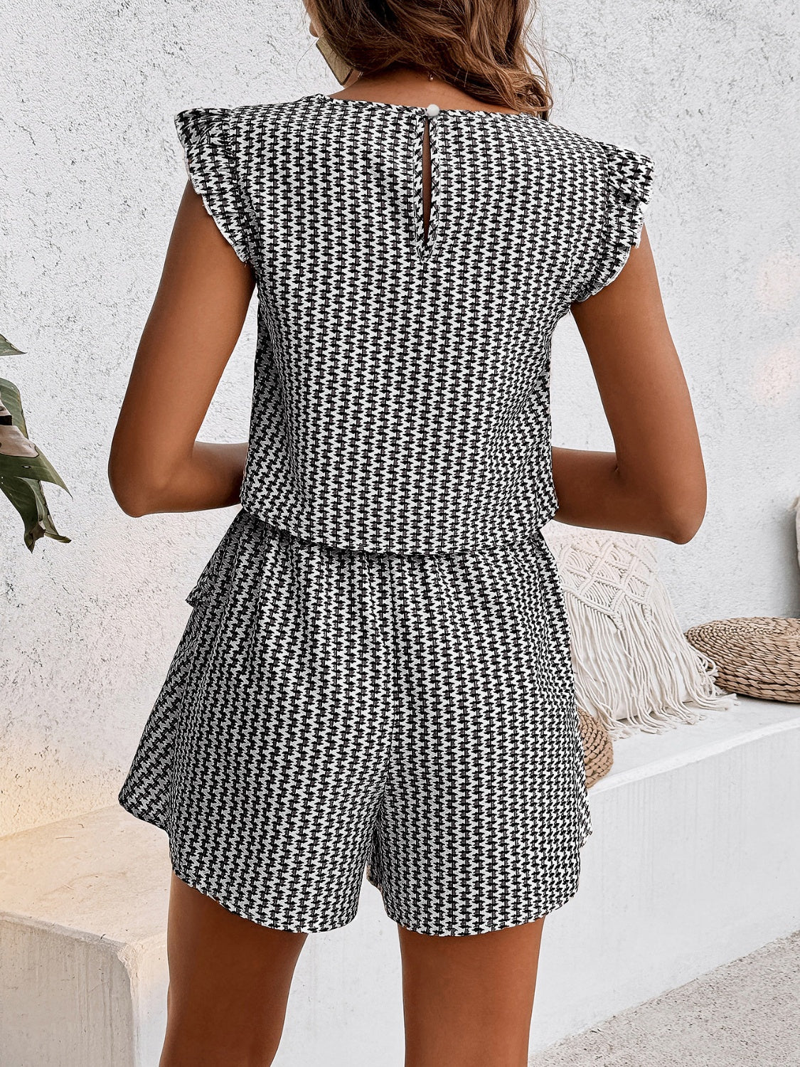Black and white houndstooth co-ord set with ruffle sleeve top and shorts.